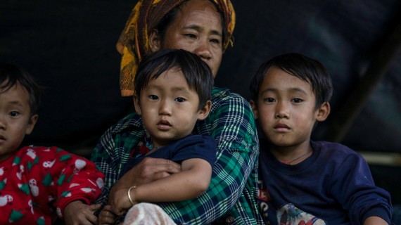 A displaced family reaches safety near the Thai border in Kayah State, Myanmar.